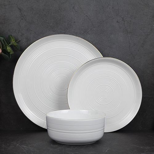 white porcelain tableware with gold rim
