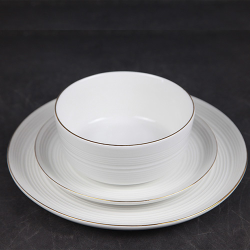 white porcelain tableware with gold rim