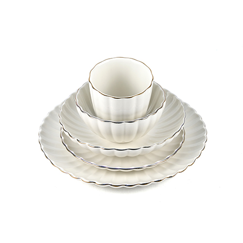 gold rimmed white porcelain dinner set