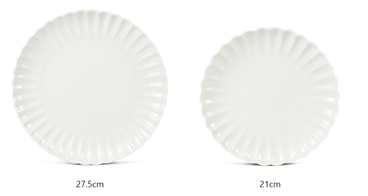 white porcelain dinner plates with flower petal design