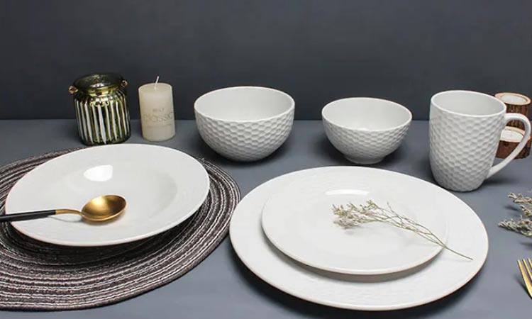 white porcelain dinner set with embossed design