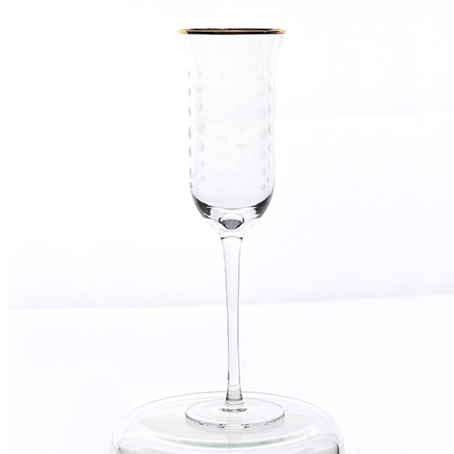 clear champagne flute glass with gold rim