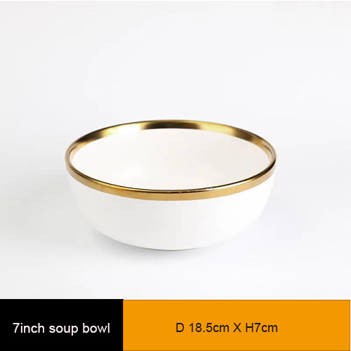 white ceramic dinner bowl with gold rim