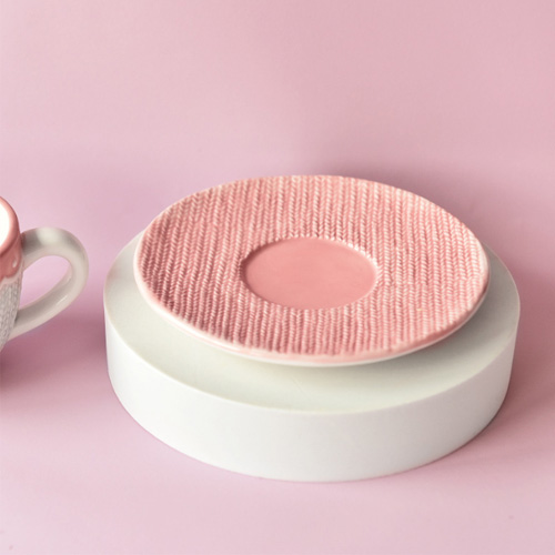 pink ceramic saucer with emboss design