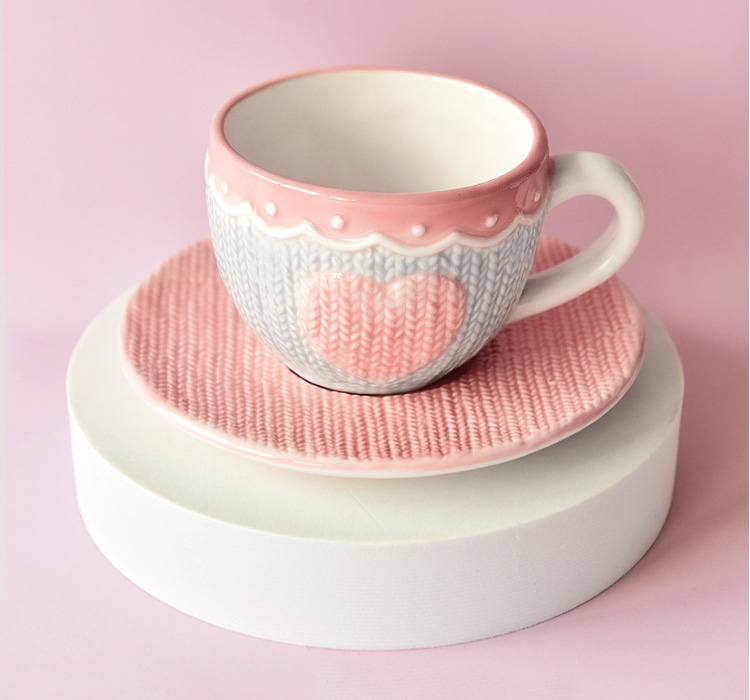 pink ceramic coffee mug with emboss design