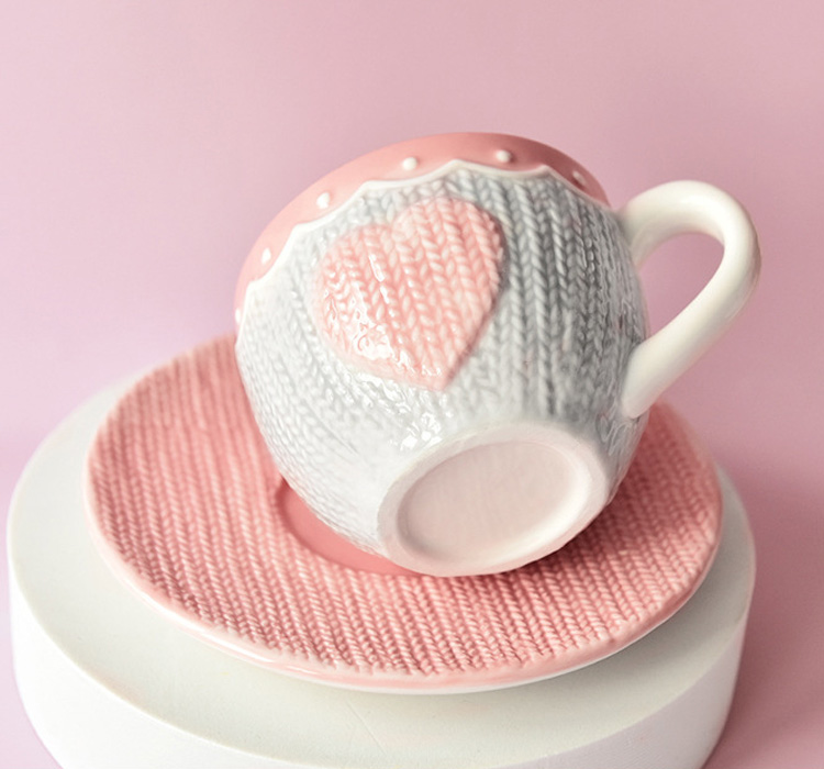 embossed pink ceramic cup and saucer