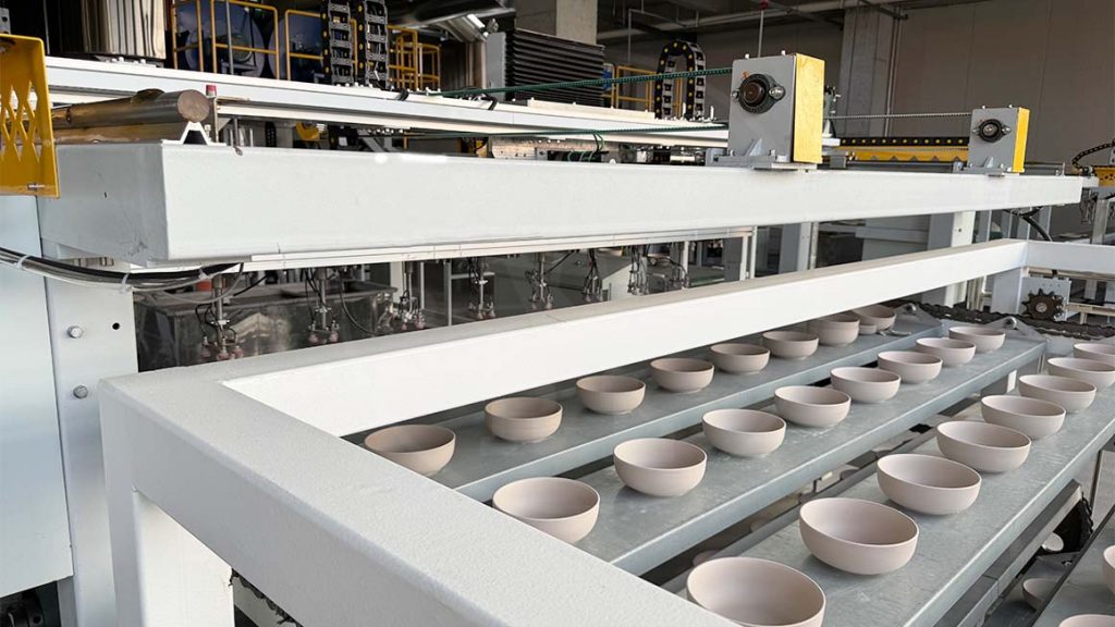 Ceramic bowls moving through an automated tableware production line