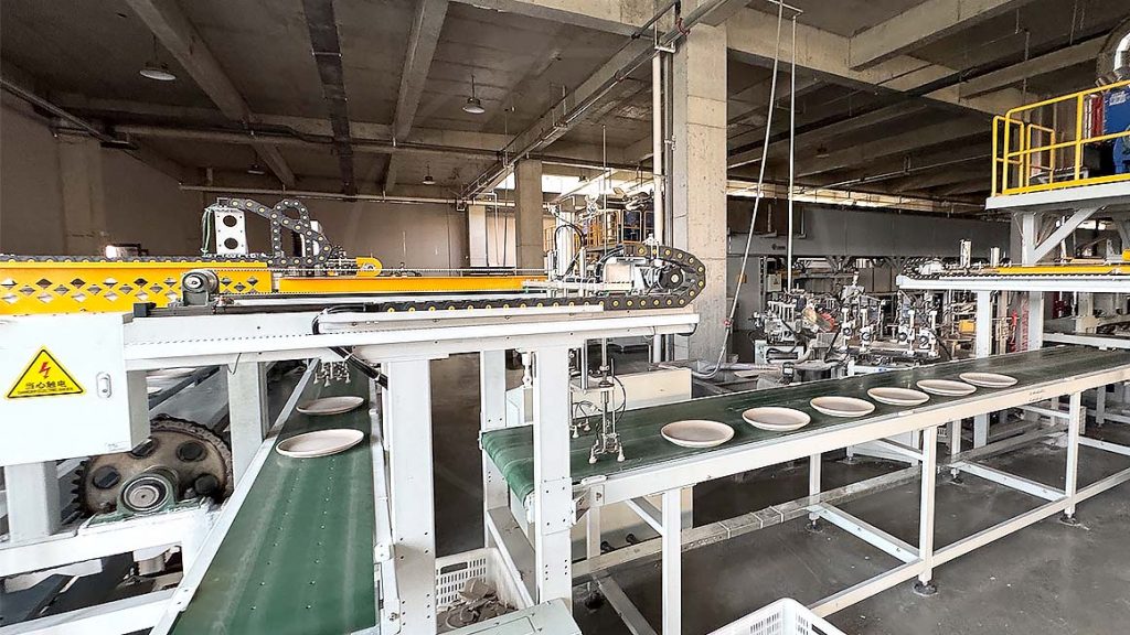 Ceramic plates moving along an automated production line
