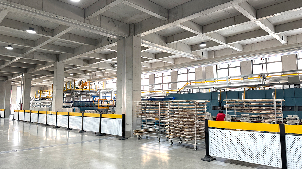 Modern ceramic factory with automated production lines and ceramic tableware racks