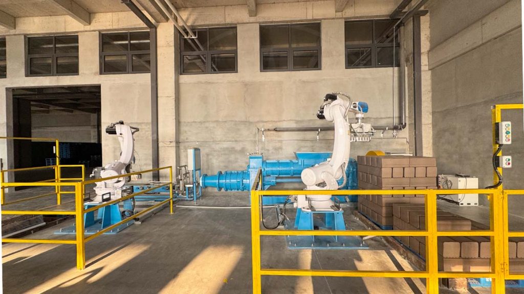 Robotic equipment operating inside Raylon’s automated ceramic factory